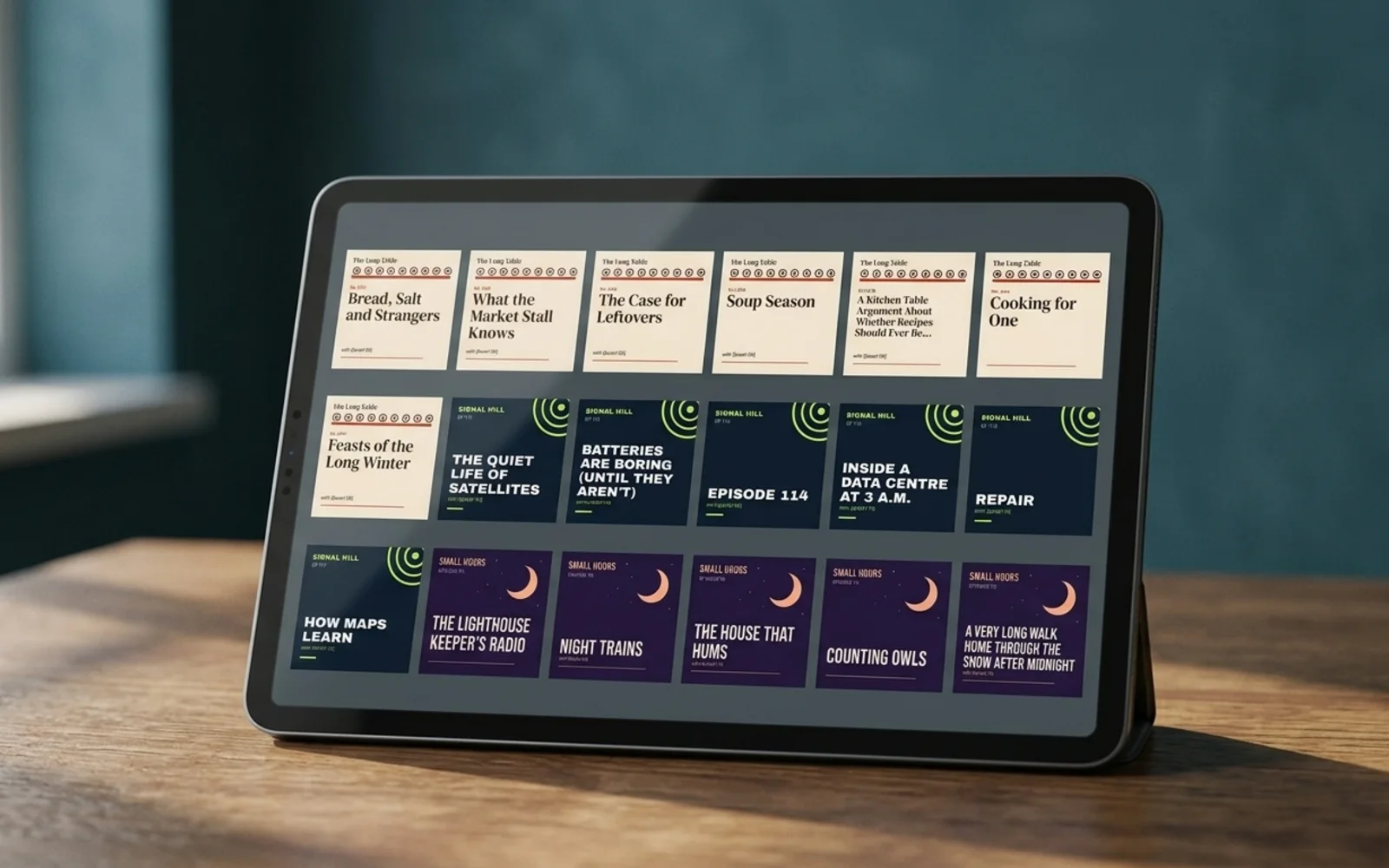 Episodic's showcase pages shown in a photographic mockup: a tablet on a desk showing a grid of episode tiles in a podcast app